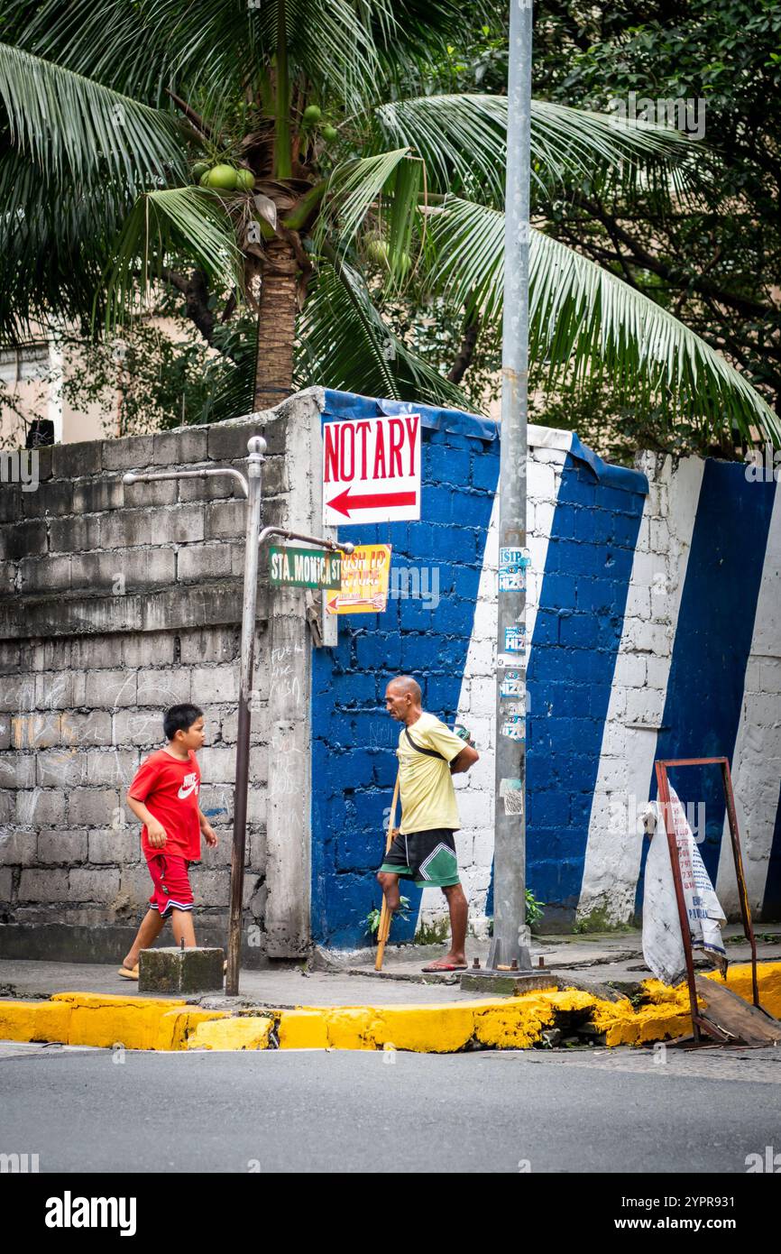 Pedestrians make their way along an interesting junction with a painted ...