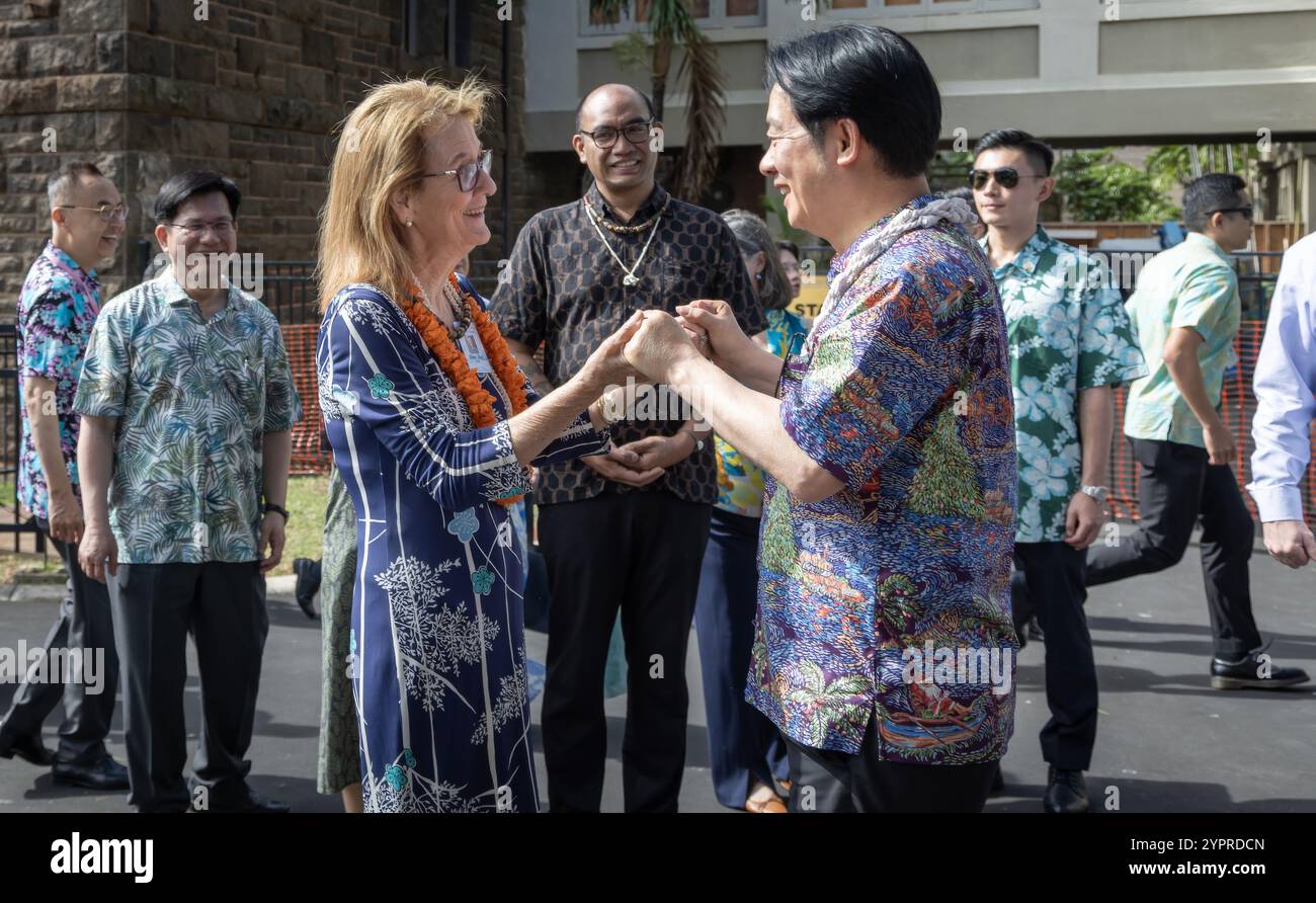 Honolulu, United States. 30th Nov, 2024. Taiwan President Lai Ching-te, right, is greeted by Bishop Museum CEO Dee Jay Mailer, left, on arrival for a visit to the museum, November 30, 2024 in Honolulu, Hawaii. Credit: Liu Shu Fu/Taiwan Presidential Office/Alamy Live News Stock Photo