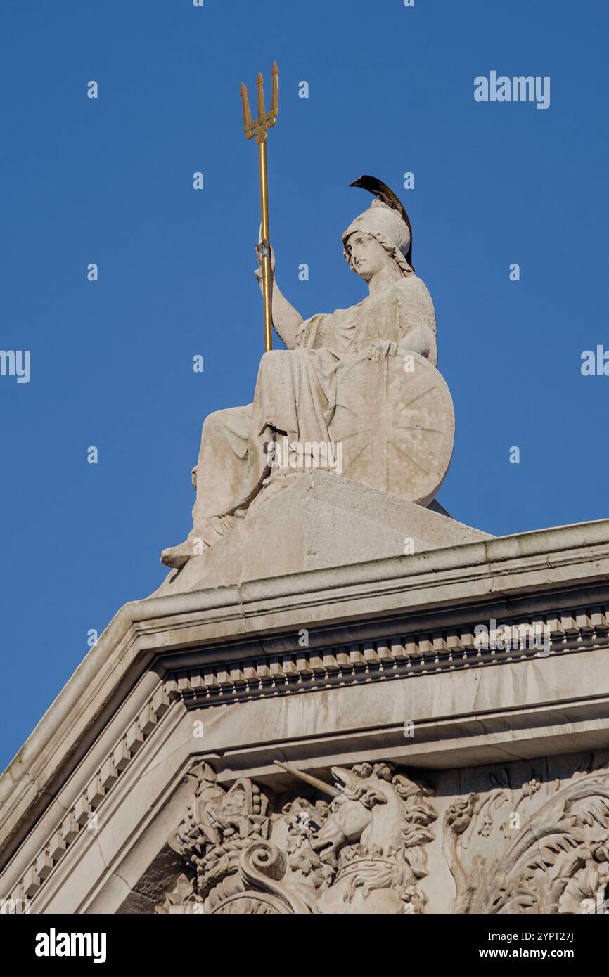 Sculpture of Britannia with trident, seated above entrance to Somerset House, Lancaster Place, The Strand, London UK Stock Photo