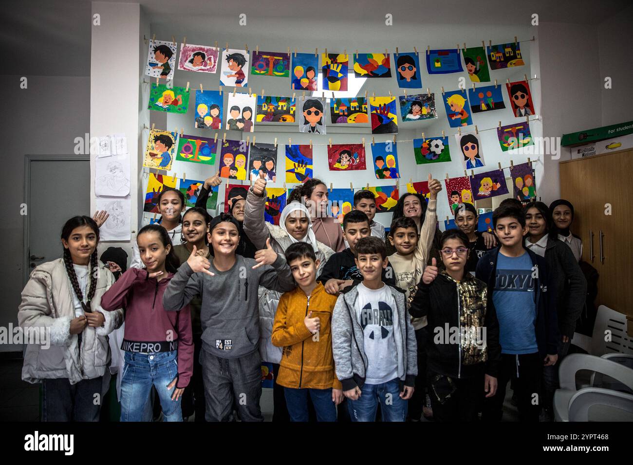 Beirut, Lebanon. 21st Nov, 2024. Children celebrate Children's Day at the offices of NGO Mouvement Social in Bourj Hammoud, Beirut. Israel launched one of the most intense aerial campaigns in contemporary history against Lebanese militant group Hezbollah from September 2024, particularly targeting Beirut's southern suburbs among other areas of the country. (Photo by Sally Hayden/SOPA Images/Sipa USA) Credit: Sipa USA/Alamy Live News Stock Photo