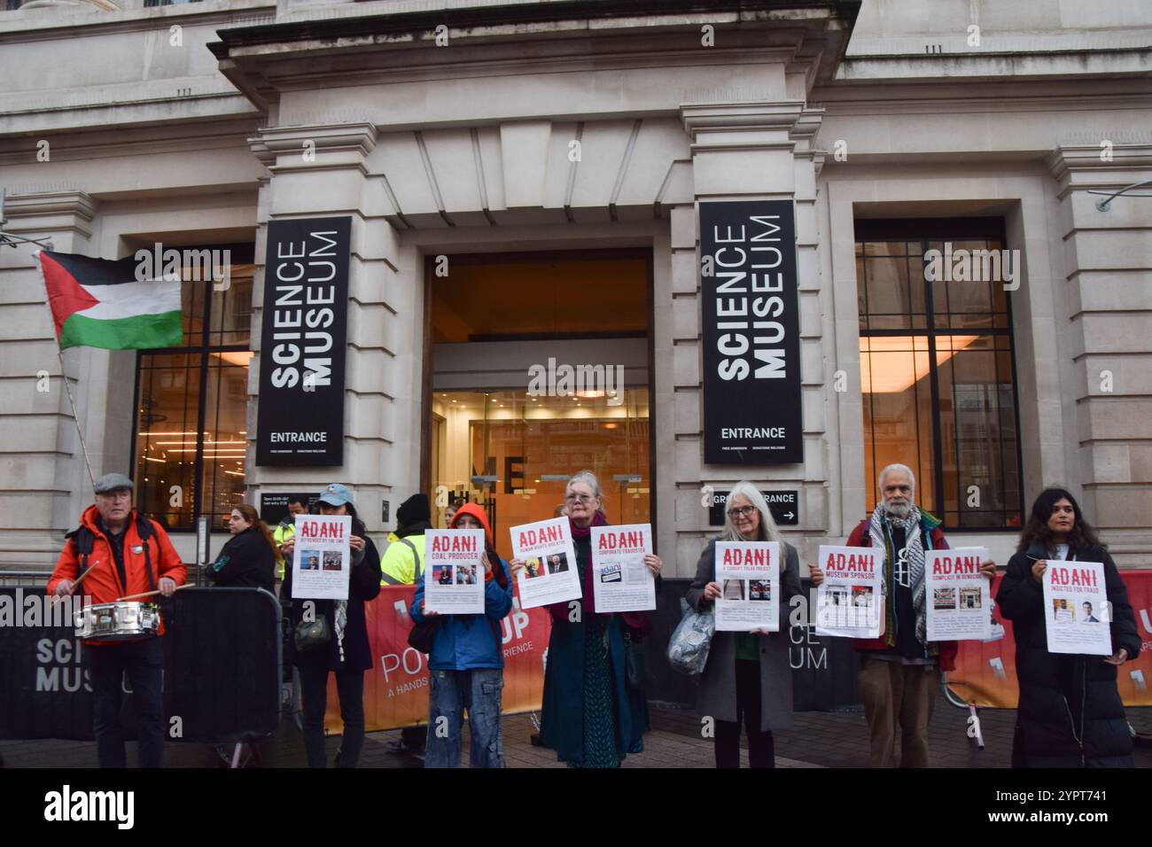 London, UK. 1st December 2024. Activists stage a protest outside the Science Museum against Adani sponsorship. The company, whose founder and chairman Gautam Adani faces fraud charges in USA, is the world's largest producer of coal and, the activists say, has ties to weapons manufacturers supplying Israel. Credit: Vuk Valcic/Alamy Live News Stock Photo