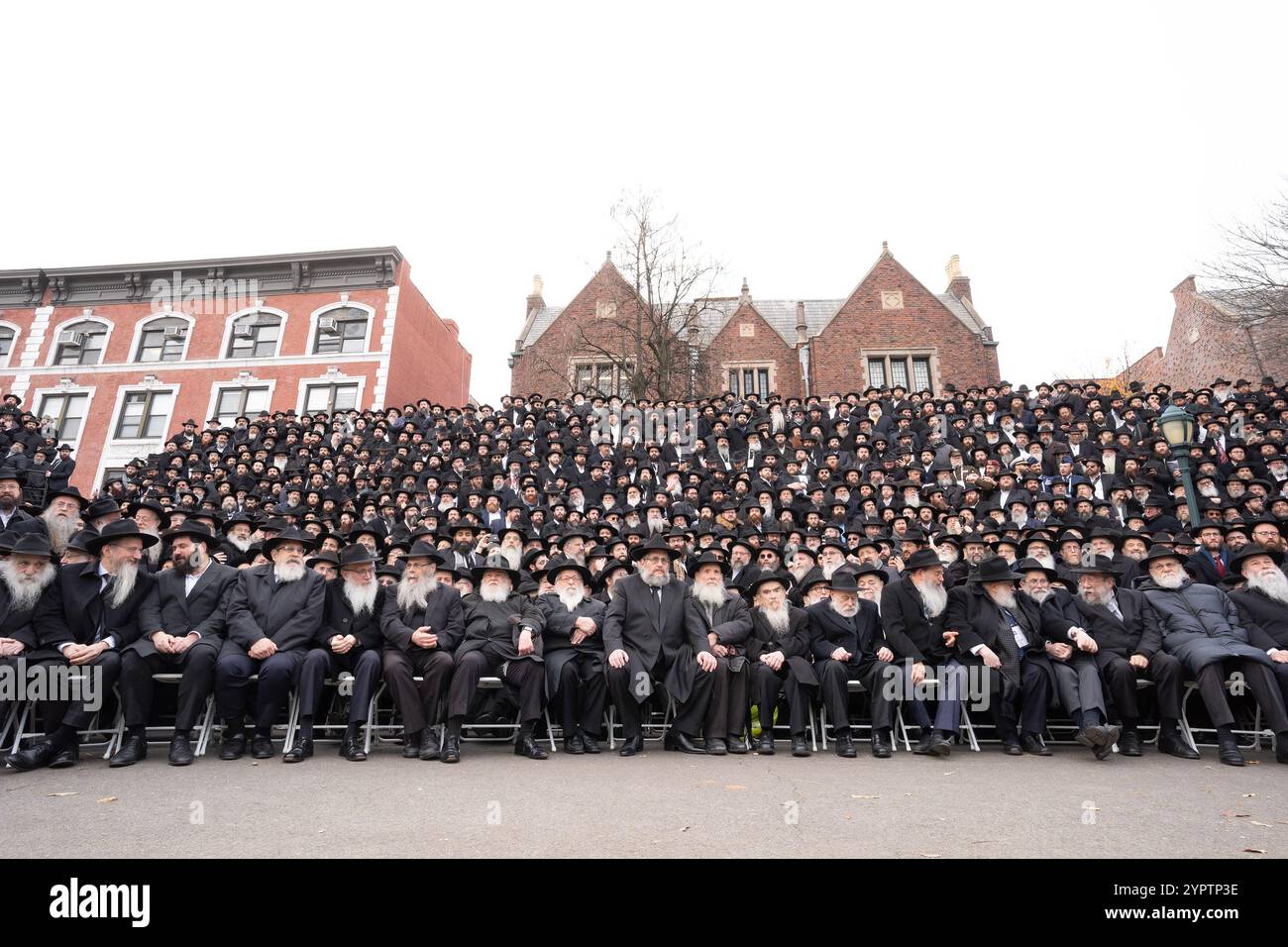 New York, USA. 01st Dec, 2024. Thousands Rabbis gather for Annual International Conference Shluchim of Chabad-Lubavitch Emissaries (Kinus Hashluchim) class photo in front of Chabad headquarters in Brooklyn, New York on December 1, 2024. The Kinus is the largest rabbinic gathering in the world. It features four days of workshops, a spiritually uplifting Shabbat and a visit to the Ohel, the place where the Lubavitcher Rebbe, Rabbi Menachem M. Schneerson was laid to rest. (Photo by Lev Radin/Sipa USA) Credit: Sipa USA/Alamy Live News Stock Photo