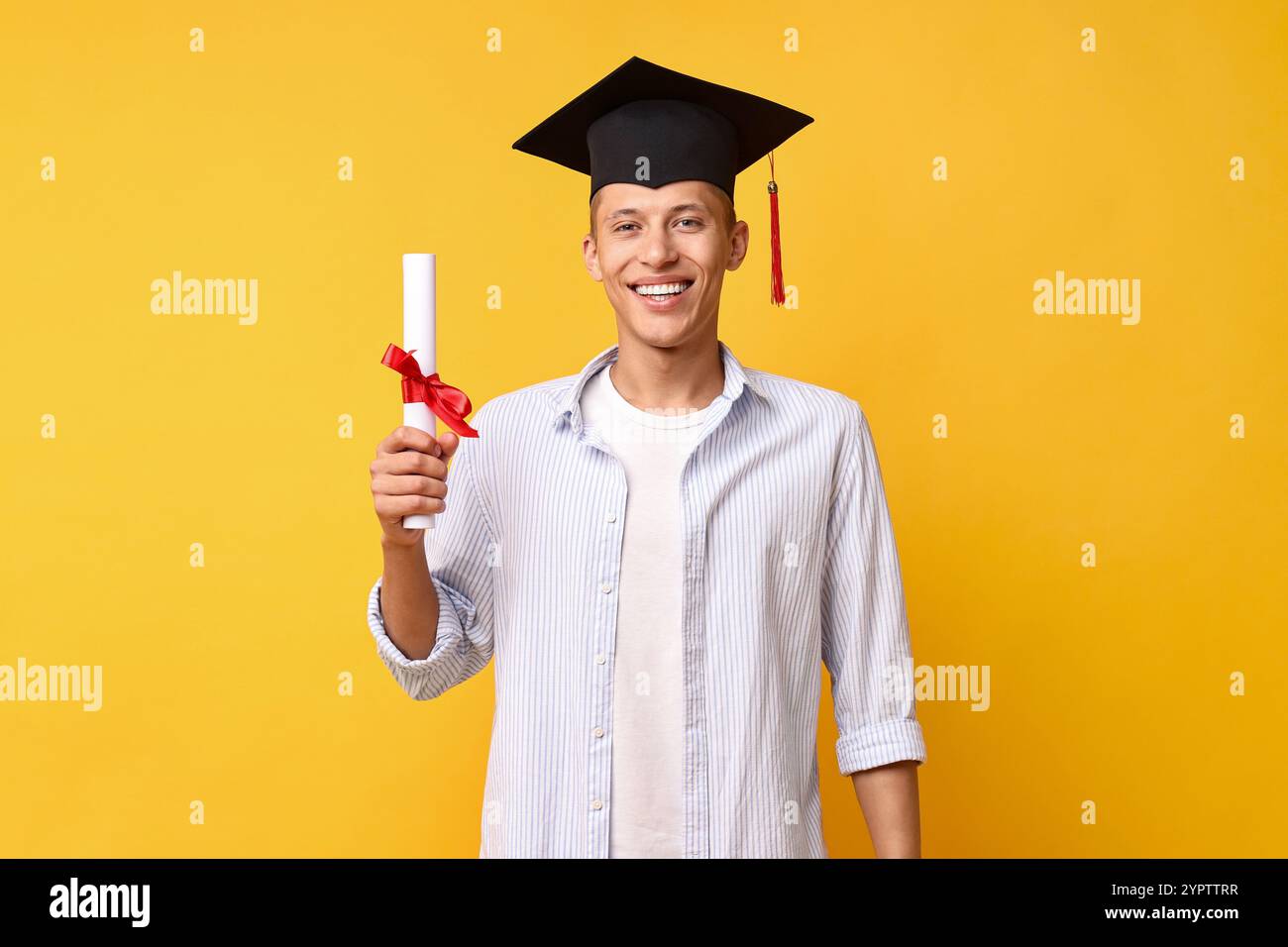 Happy student with diploma after graduation on orange background Stock ...