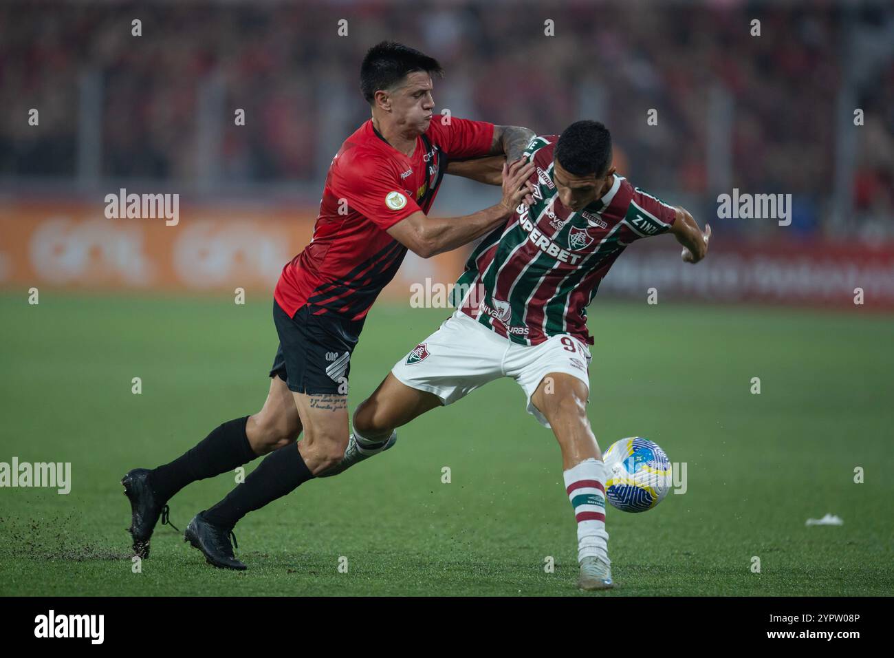 Curitiba, Brazil. 01st Dec, 2024. Leo Godoy (left) and Kevin Serna (right) during the football match between Athletico Paranaense vs Fluminense as part of the Brasileirao Serie A 2024 at Arena Ligga on December 01, 2024 in Curitiba, Brazil. (Hedeson Alves/SPP) Credit: SPP Sport Press Photo. /Alamy Live News Stock Photo