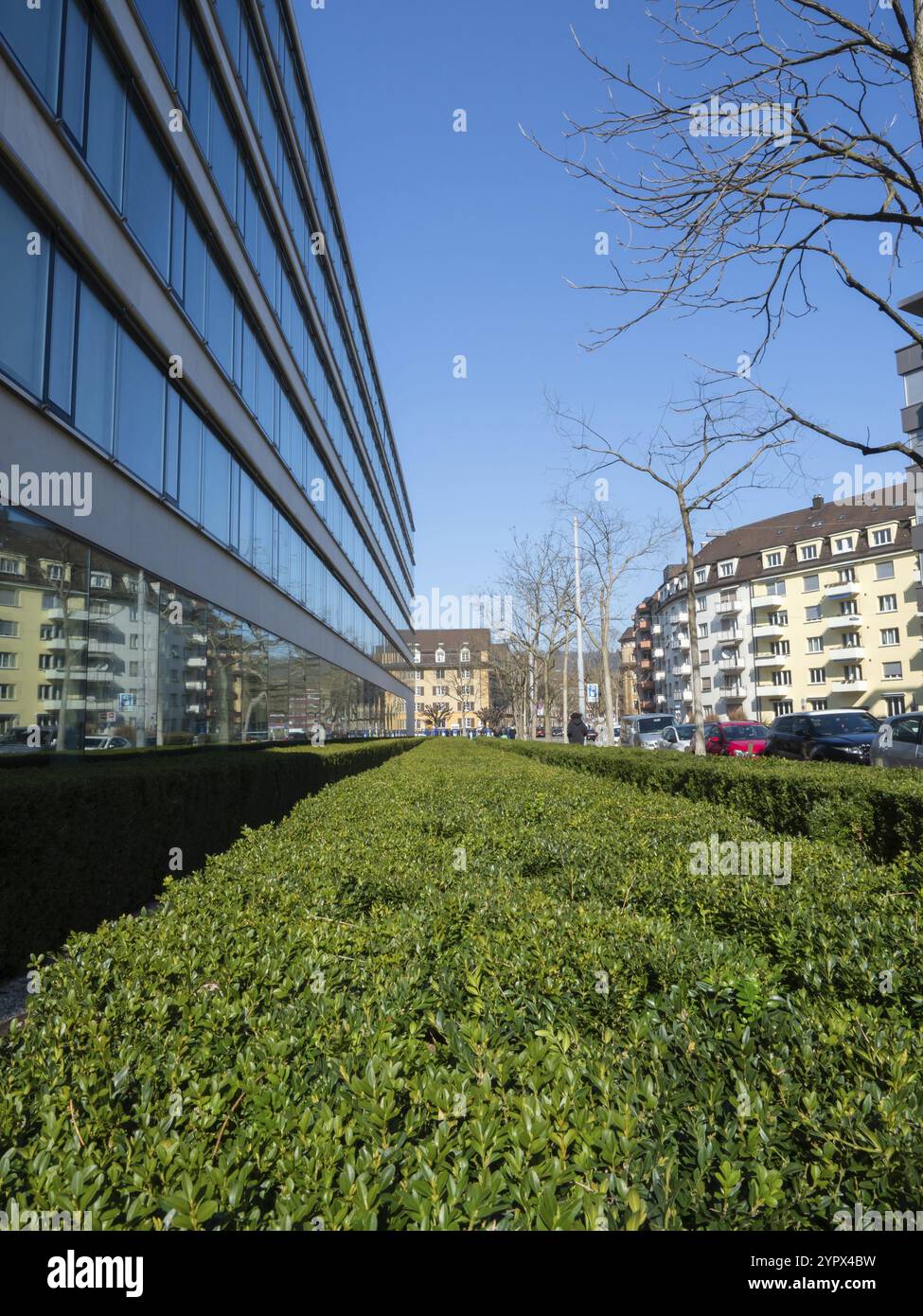 Modern insurance building and green space within a historic housing ...