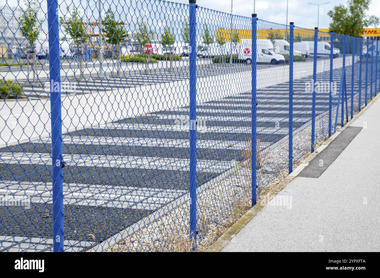 Blue steel wire mesh fence around the protected area. Restricted area protection Stock Photo
