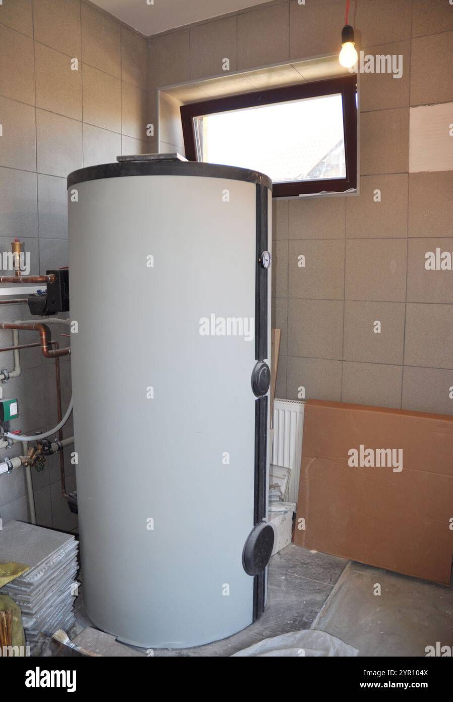 View of Installing solar water tank in boiler room. Solar water heating system ...