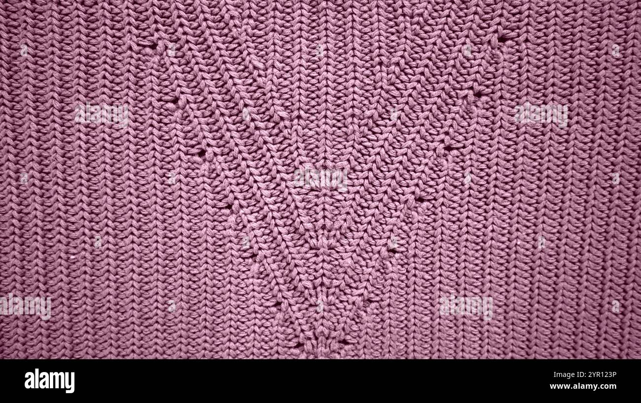 Background filled with knitting texture. With ornament. Purple color. Vertical stripes. The stripes form triangles in the middle of the background. De Stock Photo