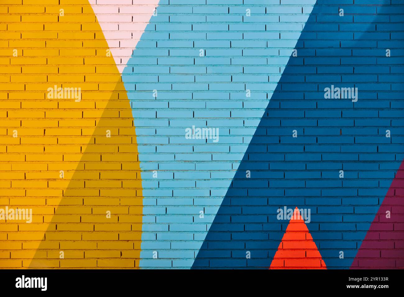 Multi colored abstract textured background. Colored brick wall backdrop Stock Photo