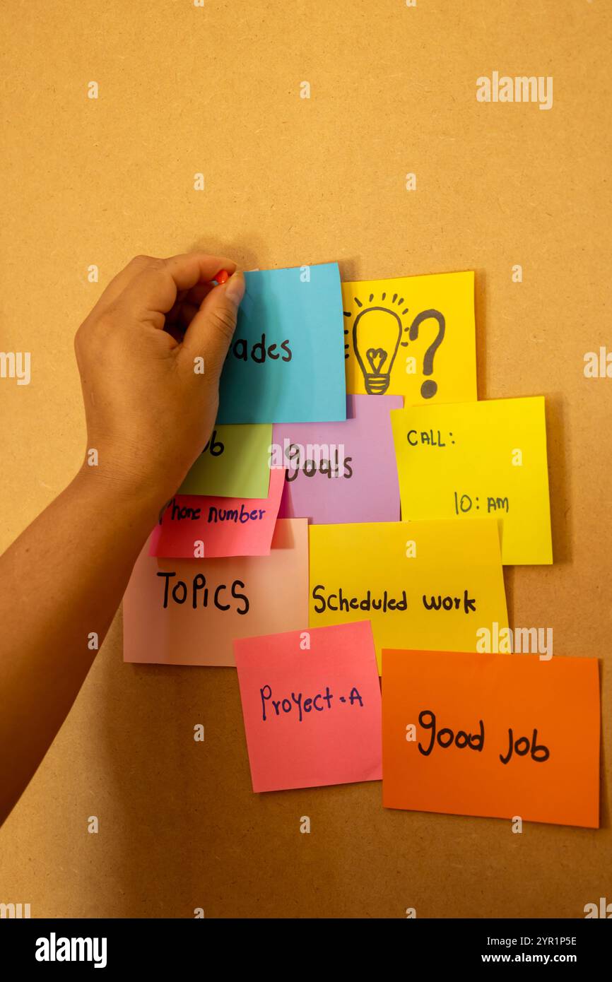 Woman putting color paper pieces hi-res stock photography and images ...