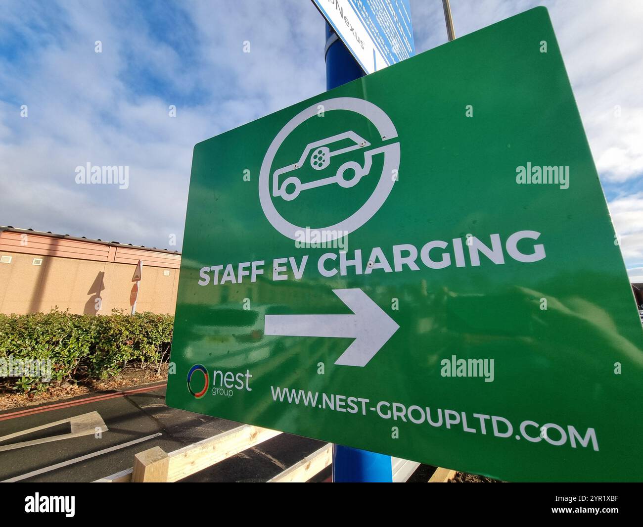EV charging point and sign UK - Smartphone Captured Stock Image