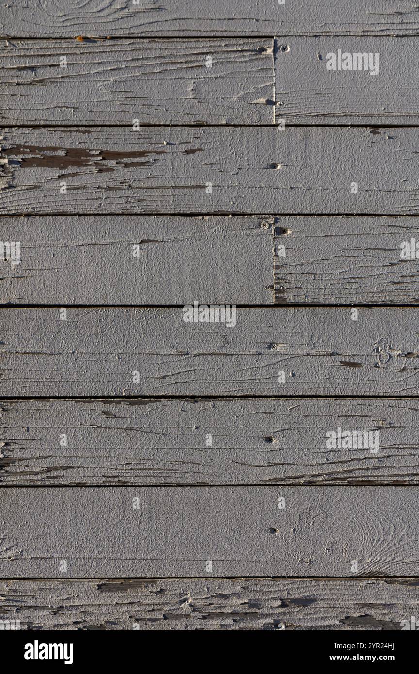 Weathered wooden planks provide a rustic texture that enhances artistic expression and creative projects. Stock Photo