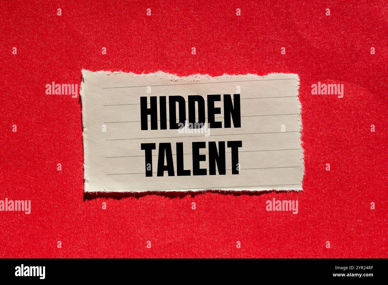 Hidden talent message written on ripped torn paper piece with red