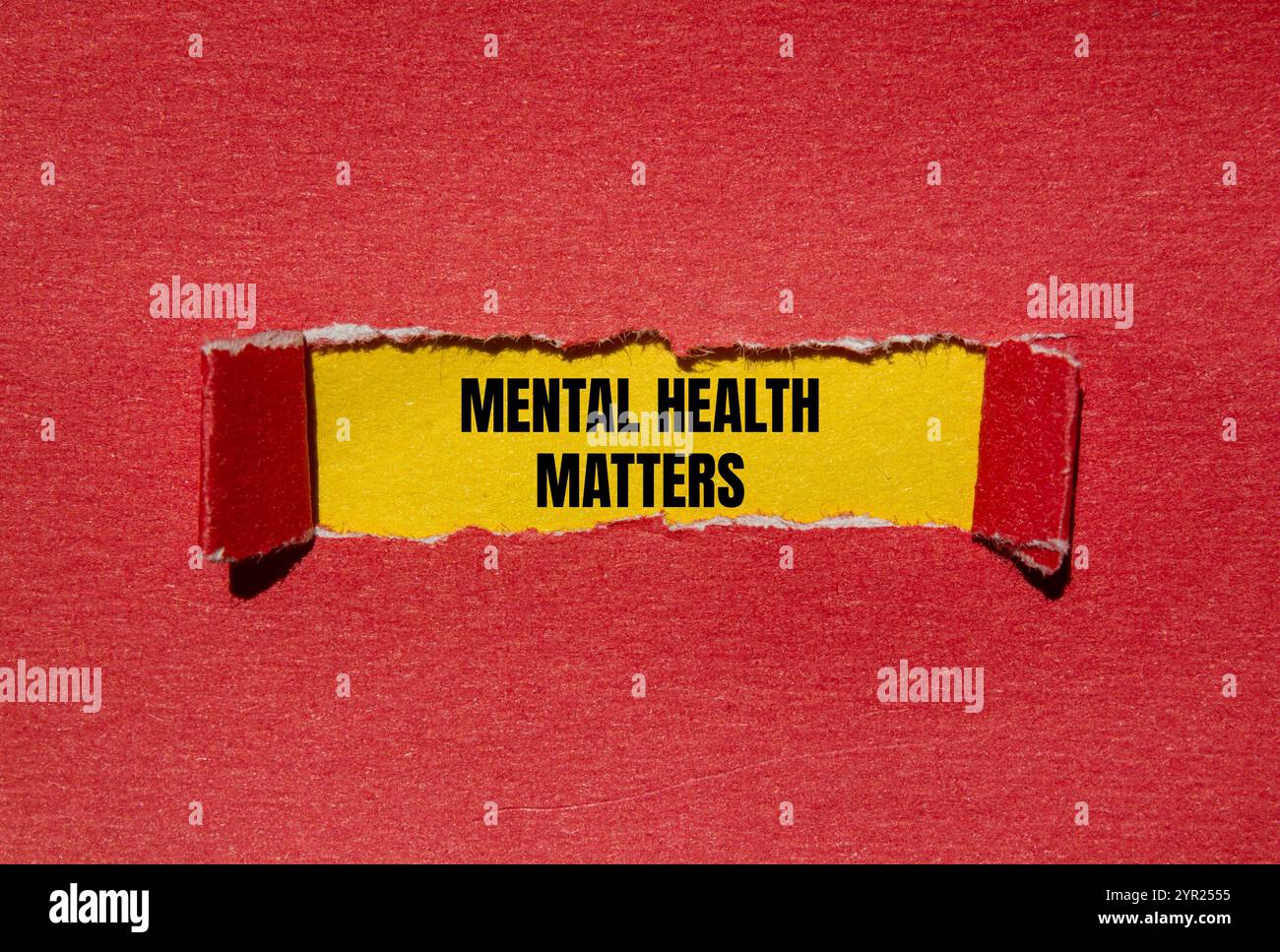 Mental health matters message written on ripped torn red paper with ...