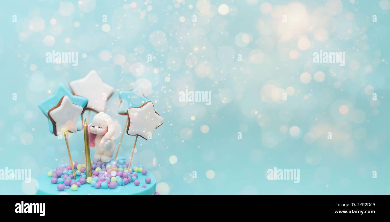 A birthday cake , decorated with bright sprinkles. A banner.Copy space. Boke. Stock Photo