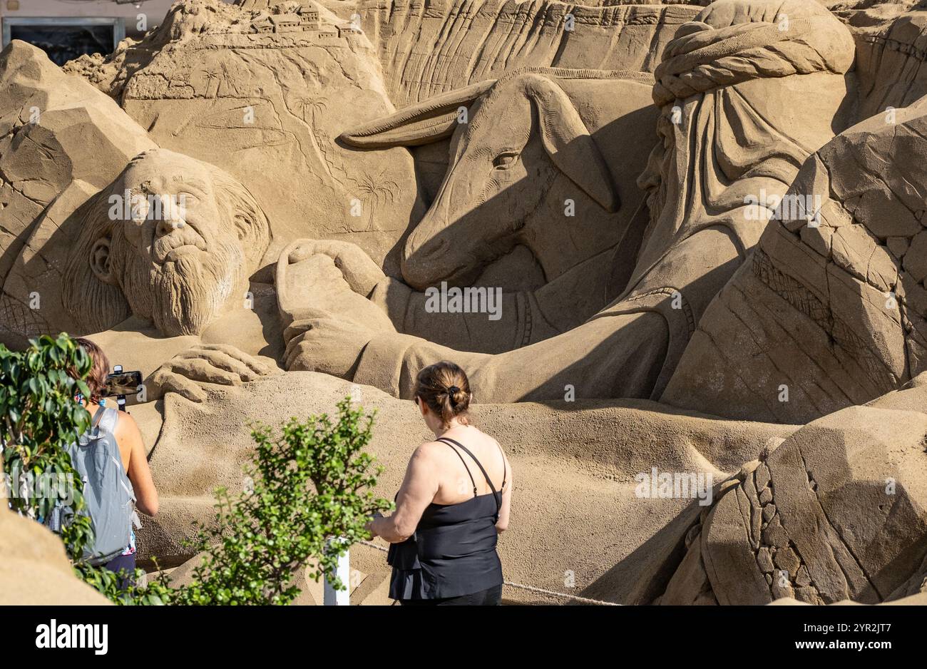 Las Palmas, Gran Canaria, Canary Islands, Spain 2nd December, 2024. Tourists and locals visit the huge sand sculptured nativity scene on the city beach in Las Palmas. The nativity scene annually attracts more the 200,000 visitors. Credit: Alan Dawson/Alamy Live News Stock Photo