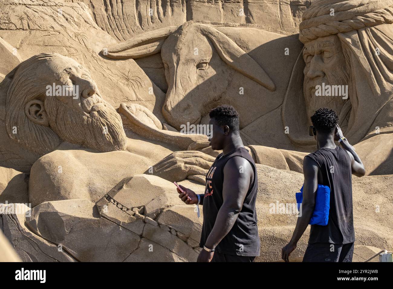 Las Palmas, Gran Canaria, Canary Islands, Spain 2nd December, 2024. Tourists and locals visit the huge sand sculptured nativity scene on the city beach in Las Palmas. The nativity scene annually attracts more the 200,000 visitors. Credit: Alan Dawson/Alamy Live News Stock Photo