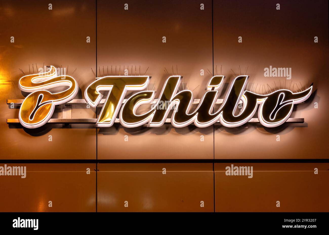 Darmstadt, Germany, 20.11.2024: Illuminated Tchibo lettering, logo ...