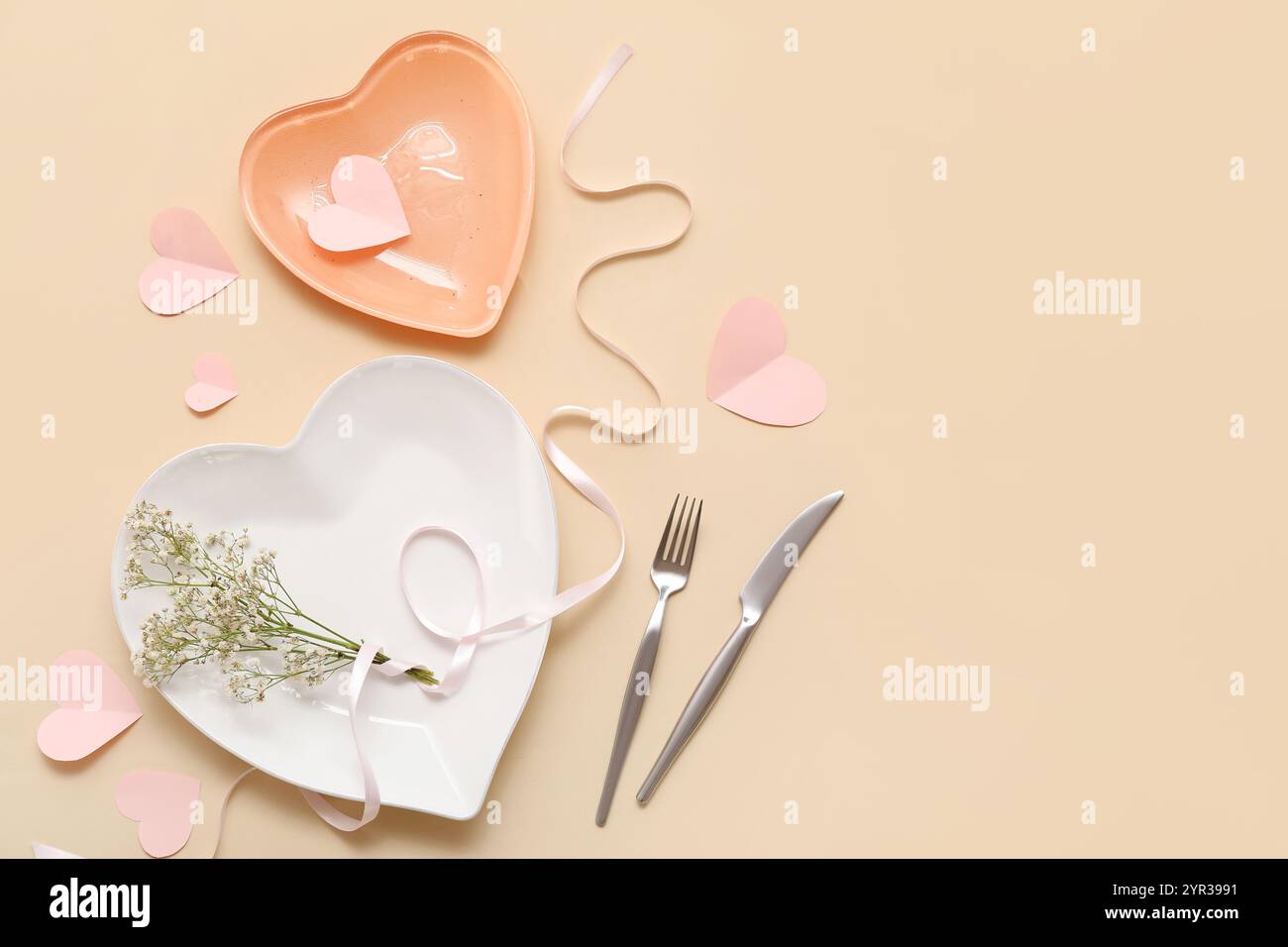 Table setting for Valentine's Day with heart-shaped plates, flowers ...