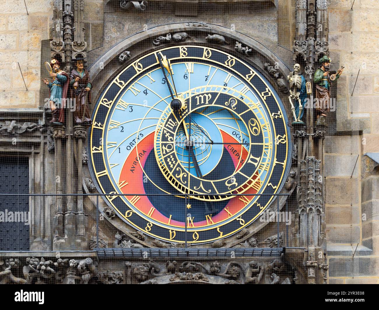 Astronomical Clock (Pražský orloj) close up on the old town hall tower in Prague. The historical mechanism on the exterior is a tourist attraction. Stock Photo
