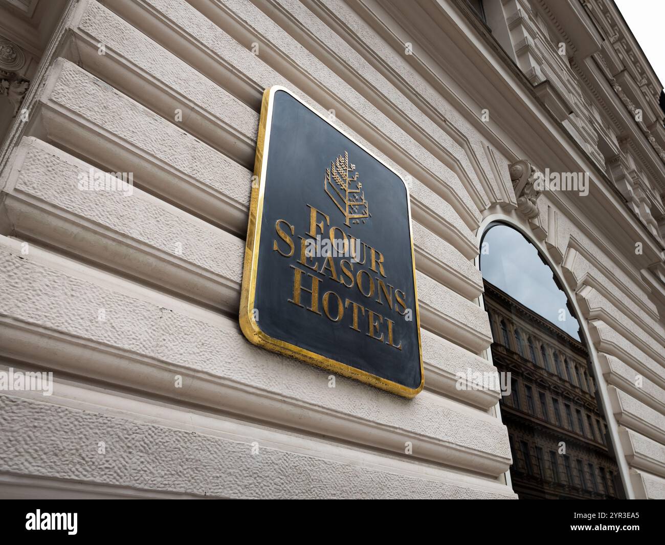 Prague Four Seasons Hotel logo sign on an old building exterior in the old town. Luxury resort with a five-star rating for wealthy people. Stock Photo