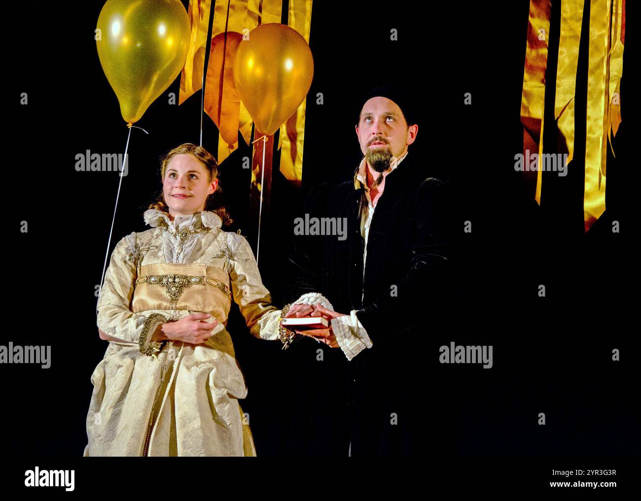 Clemmie Sveaas (Jane), Bertie Carvel (Dr Dee) in DR DEE at Palace Theatre, Manchester, England  01/07/2011 a Manchester International Festival (MIF), ENO & London 2012 Festival co-production  co-creator & composer: Damon Albarn  conductor: Andre de Ridder  set design: Paul Atkinson  costumes: Katrina Lindsay  lighting: Paule Constable  movement: Frantic Assembly  video design: 59 Productions  co-creator & director: Rufus Norris Stock Photo