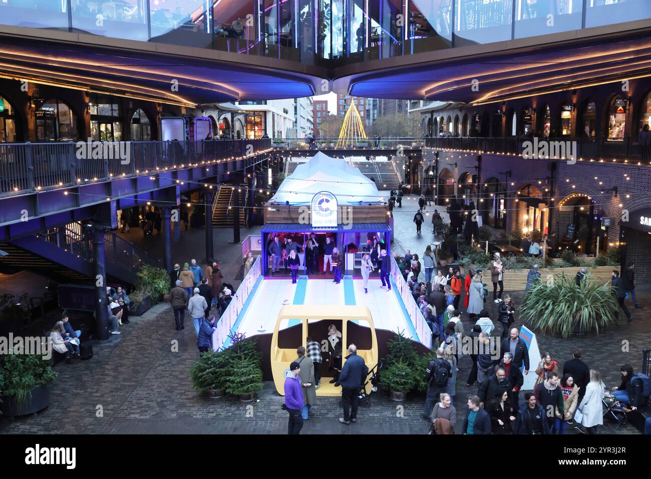 Kings Cross Club Curling, fun winter activity in Coal Drops Yard, north London, UK Stock Photo