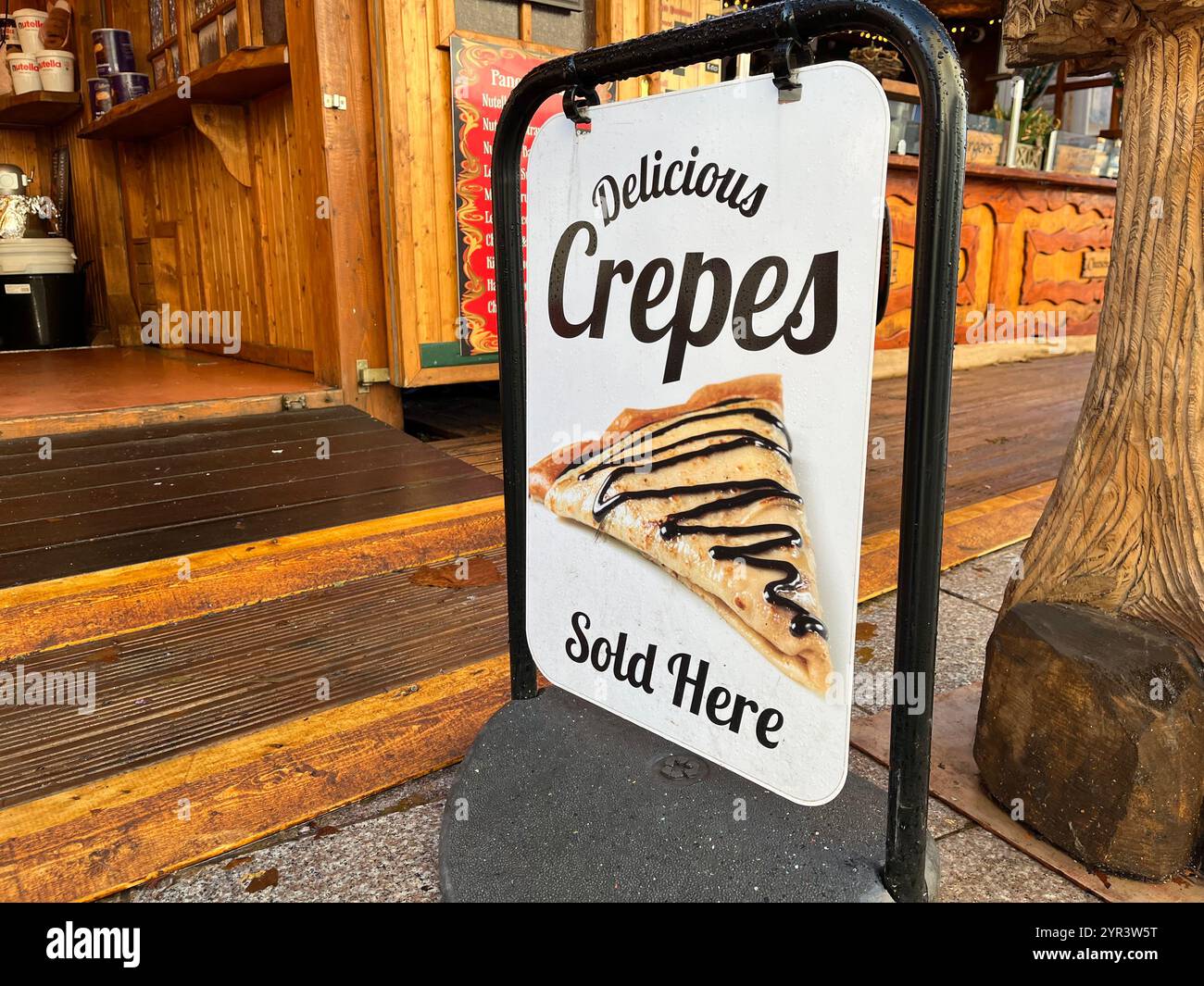 Crepes Sign at the German Style Christmas Market on Working Street next to St John's Church. Cardiff, Wales, United Kingdom. 26th November 2024. - Smartphone Captured Stock Image
