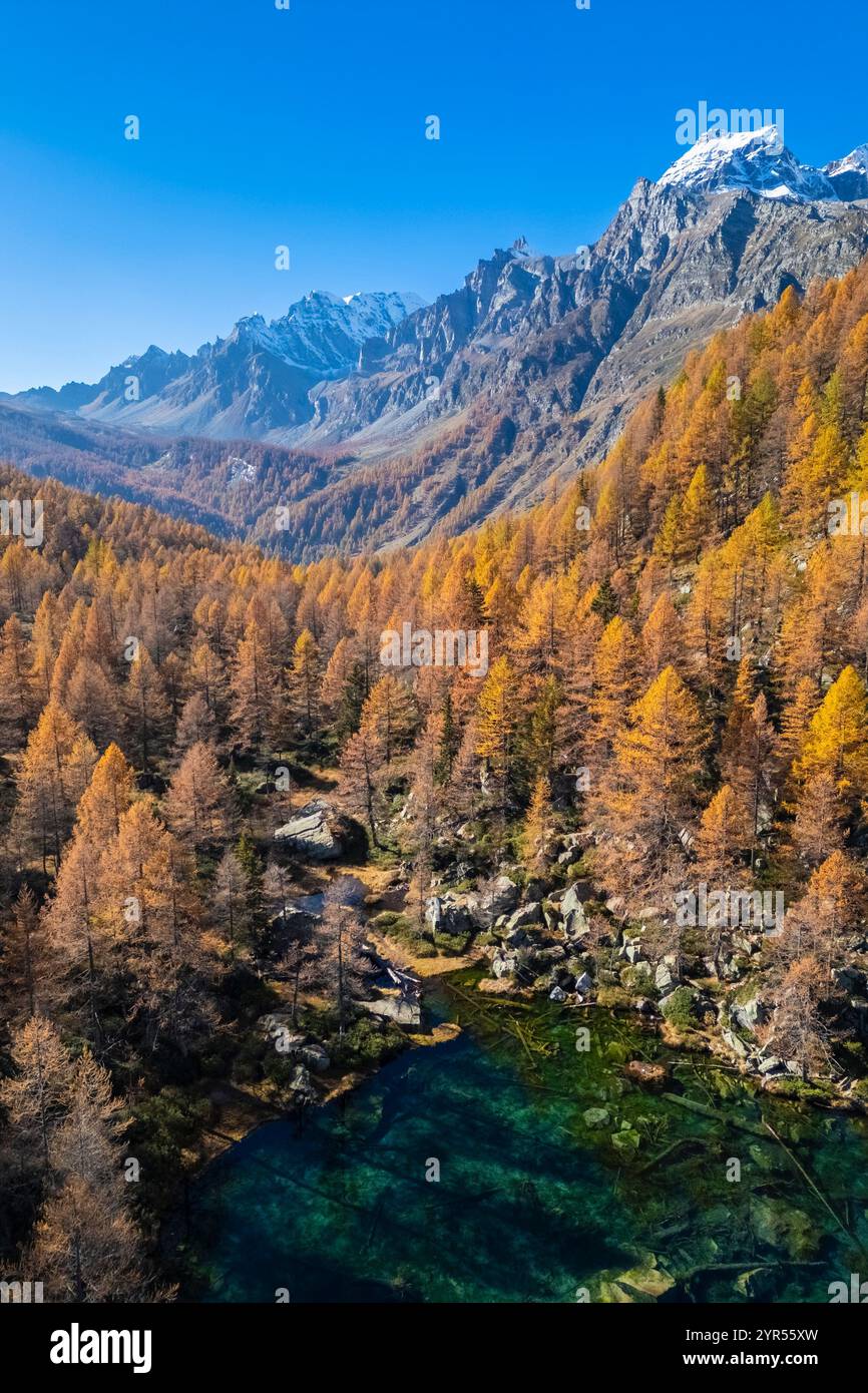 Autumnal view of the Lago delle Streghe lake at Crampiolo, Alpe Devero. Alpe Devero, Devero valley, Antigorio valley, Ossola valley, Piedmont, VCO. Stock Photo