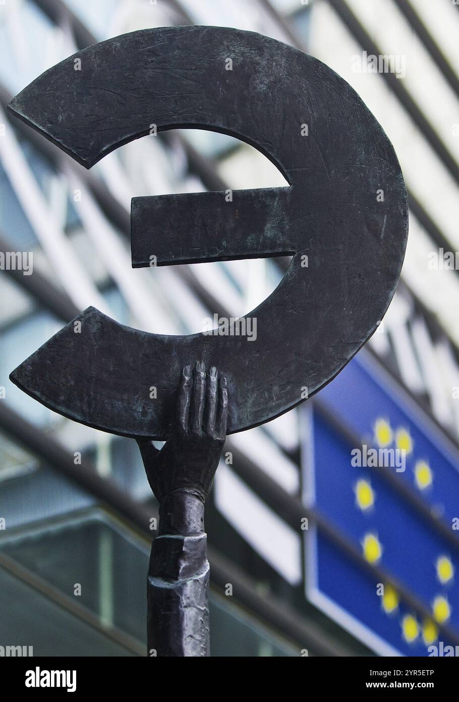 The bronze statue entitled Europe by May Claerhout holds up the euro ...