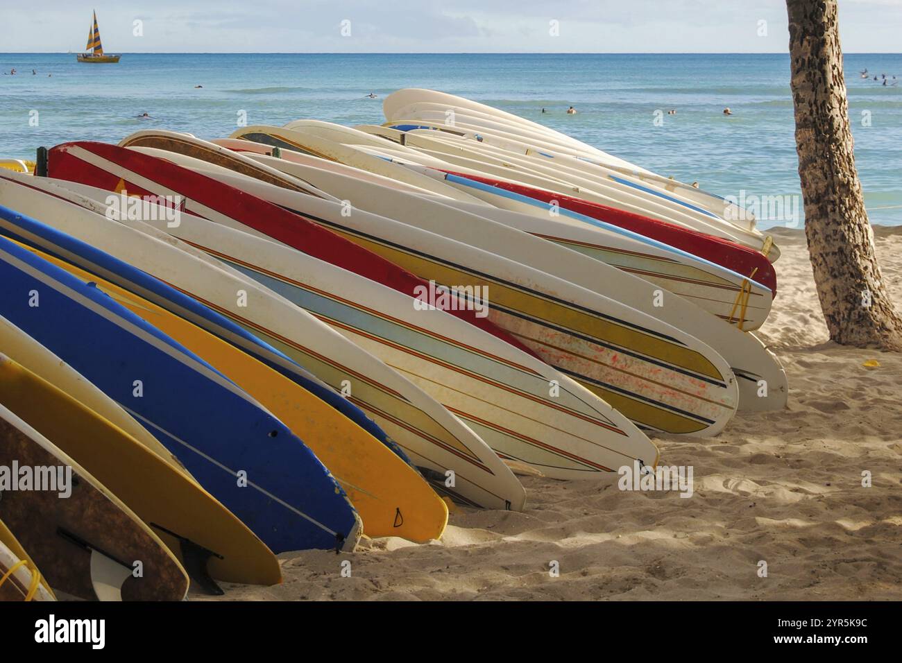 Several surfboards displayed on a rack at a beach in Hawaii Stock Photo ...
