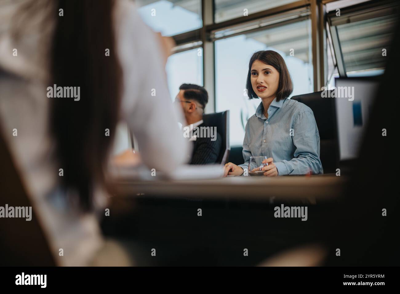 Multiracial team engaged in a productive business meeting Stock Photo ...