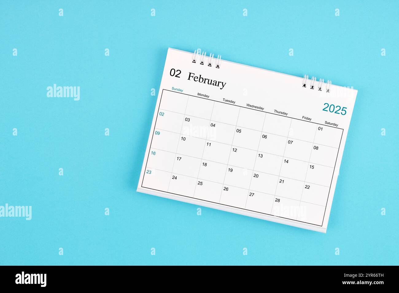 February 2025, Monthly desk calendar for 2025 year on blue color ...