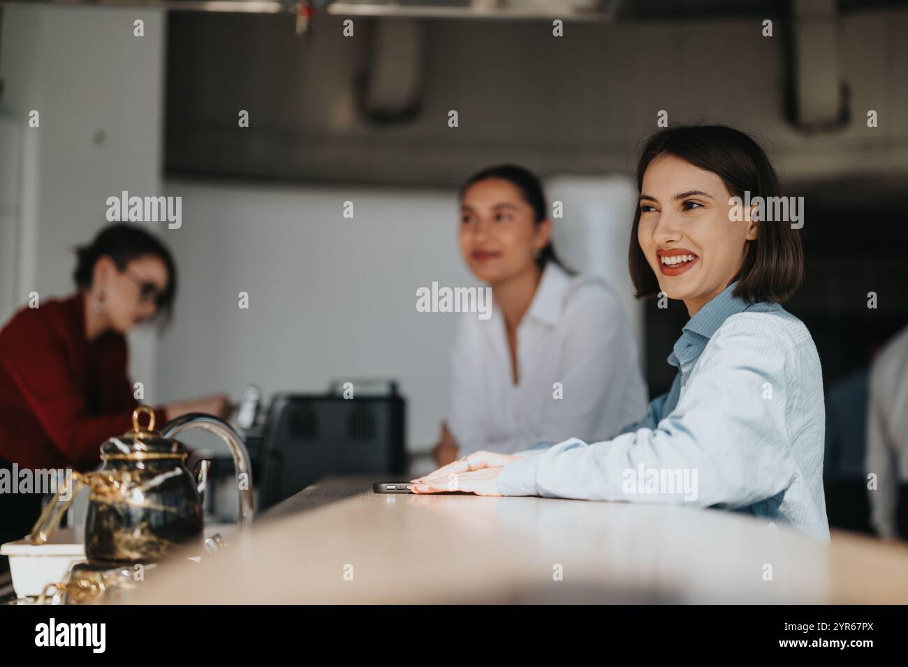 Business workers enjoying a casual break at modern office space Stock Photo
