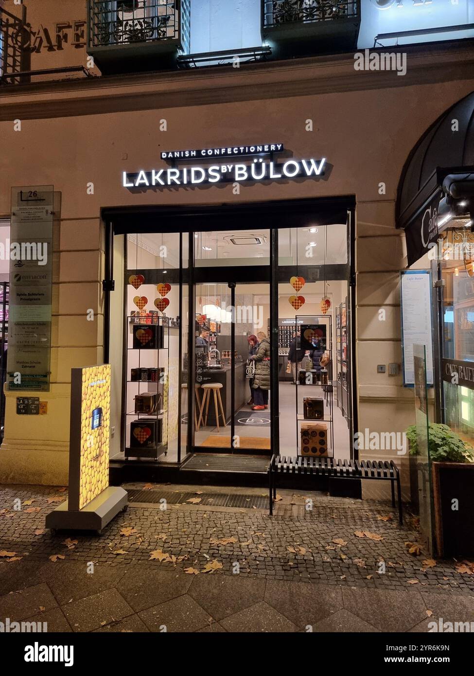 Storefron, shop facade of Danish confectionery brand Lakrids by Bülow in Berlin, Germany; licorice - Smartphone Captured Stock Image