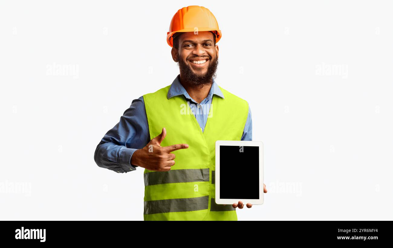 Builder Worker Showing Digital Tablet Empty Screen, Panorama, Studio Shot Stock Photo