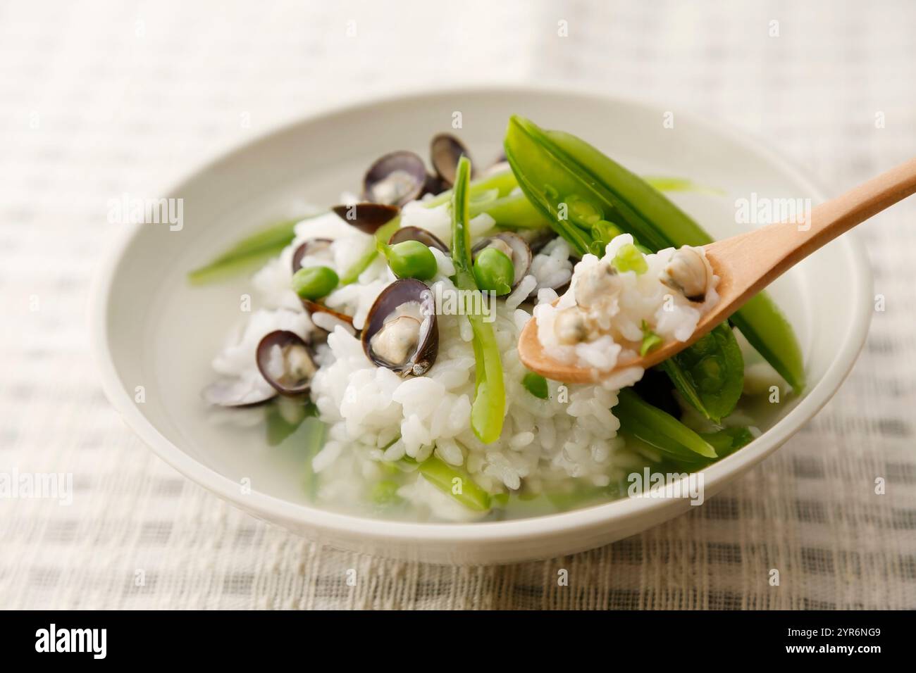 Light rice porridge with shijimi and peas Stock Photo