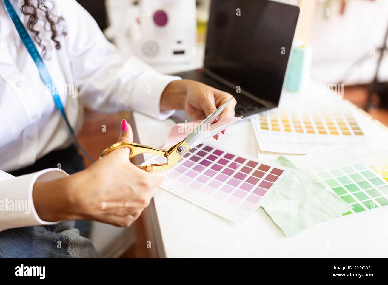 Creative designer working on fabric samples in a bright office studio Stock Photo