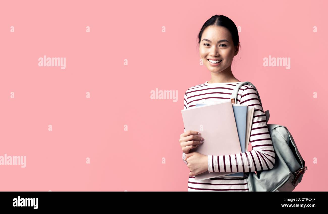 Portrait Of Young Asian Female Student With Workbooks And Backpack ...
