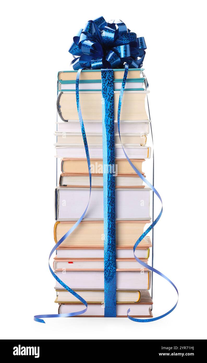 Stack of books with blue bow as gift isolated on white Stock Photo - Alamy