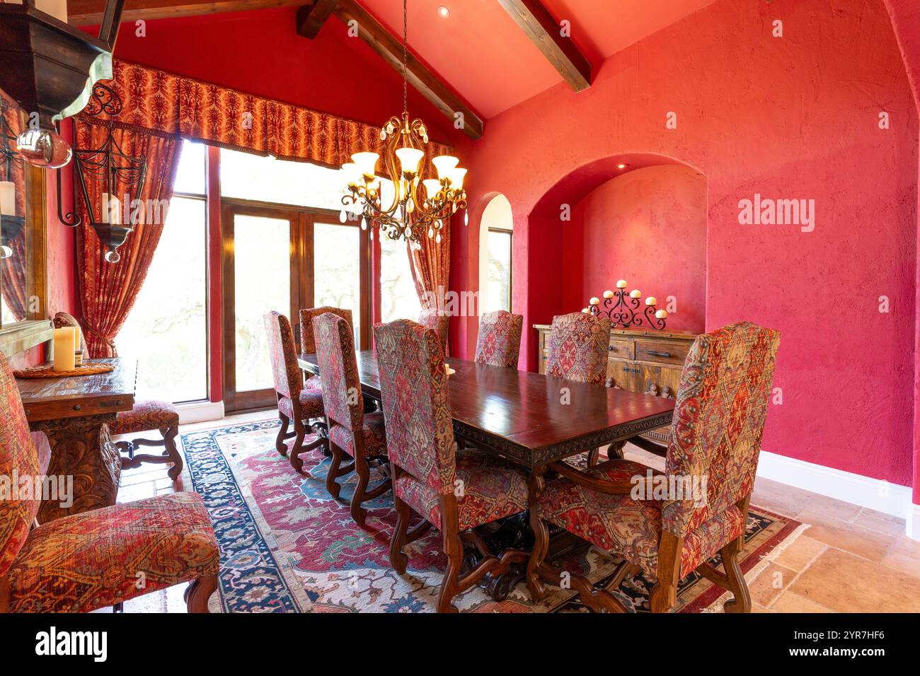 Elegant dining room with rich colors and detailed furnishings in bright ...