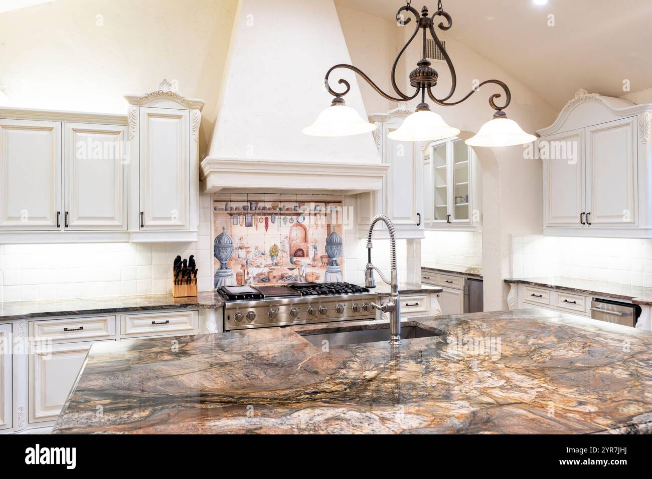 View of Elegant kitchen design featuring luxurious marble and refined cabinetry ...