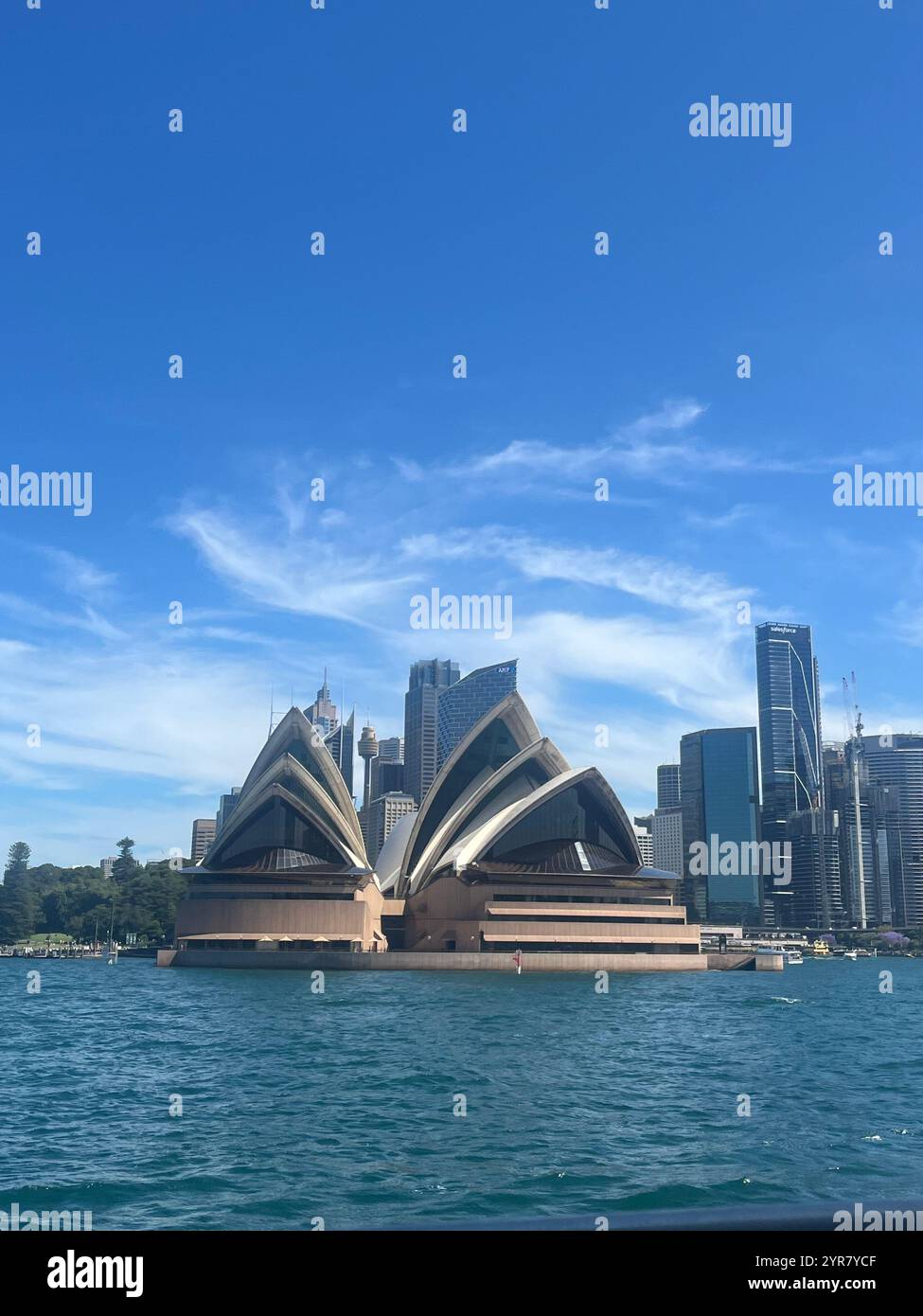 View of the famous Sydney Opera House with the city skyline in the background. - Smartphone Captured Stock Image