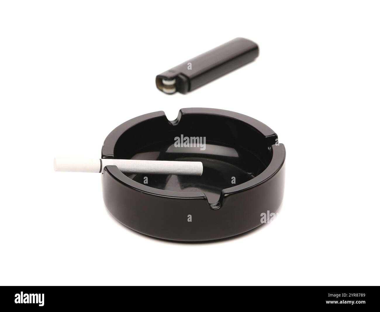Black ceramic ashtray cigarette lighter. White background. Stock Photo