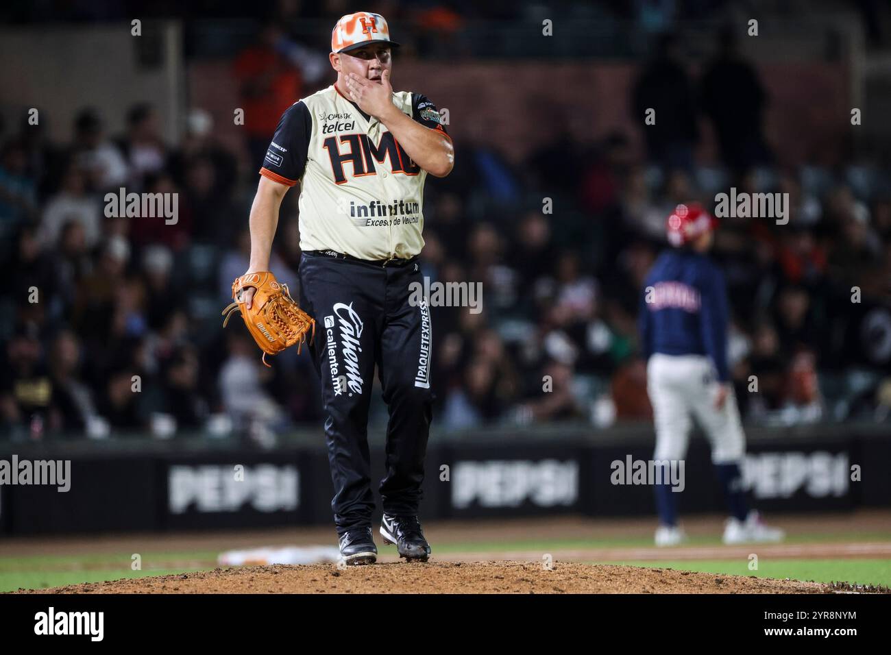 HERMOSILLO, MEXICO - NOVEMBER 29:  Luis Ernesto Marquez  relief pitcher for Naranjeros de Hermosillo in the fourth inning during a Liga Arco Mexicana del Pacifico game between Aguilas and Naranjeros at Estadio Fernando Valenzuela on November 29, 2024 in Hermosillo, Mexico.  (Photo by Luis Gutierrez/Norte Photo) Stock Photo