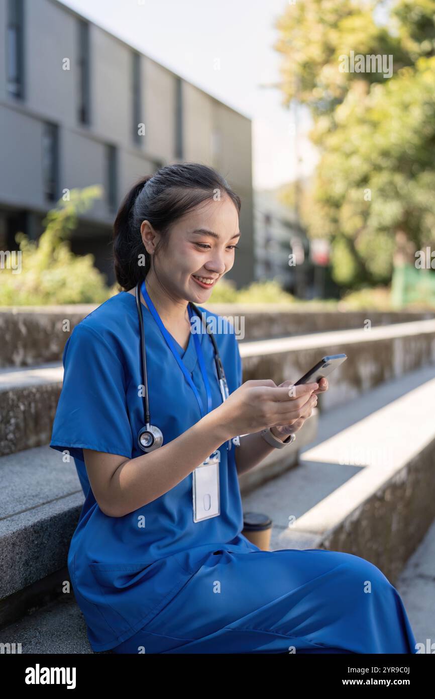 Asian, blue scrubs, woman hi-res stock photography and images - Alamy