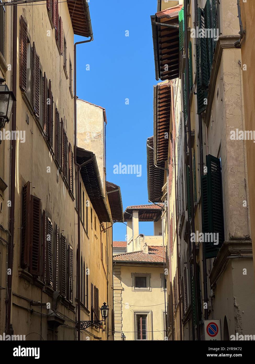 Timeless Italian architecture under a clear blue sky. - Smartphone Captured Stock Image