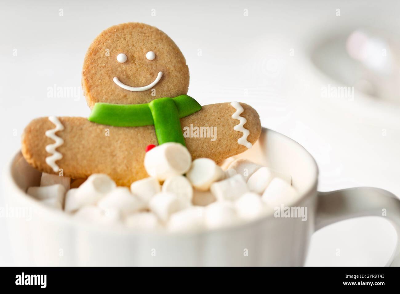 Gingerbread man enjoying a marshmallow bubble bath Stock Photo