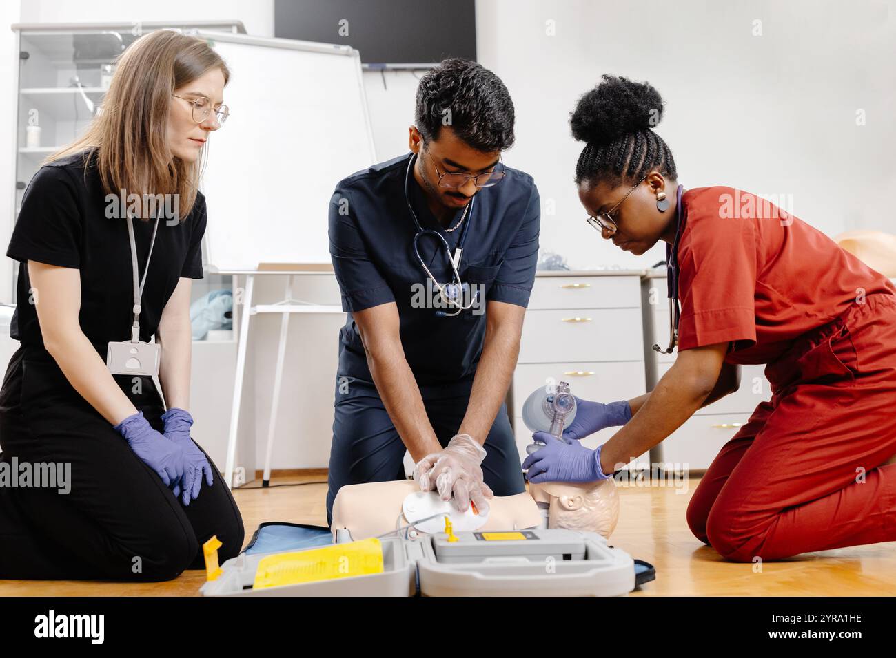 Emergency medical professionals assisting hi-res stock photography and ...