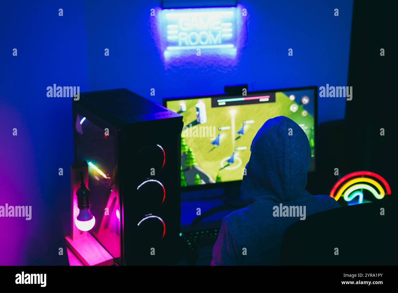 Gamer playing at strategy game online - Young person having fun with ...